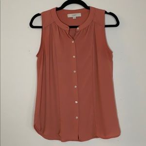 Salmon sleeveless button down blouse